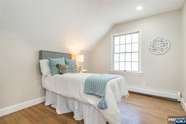 434 Argyle St, Oradell, NJ 07649 - bedroom with a baseboard heating unit, vaulted ceiling, wood finished floors, baseboards, and recessed lighting
