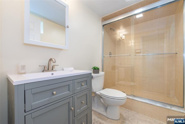 434 Argyle St, Oradell, NJ 07649 - bathroom featuring toilet, vanity, and a shower stall