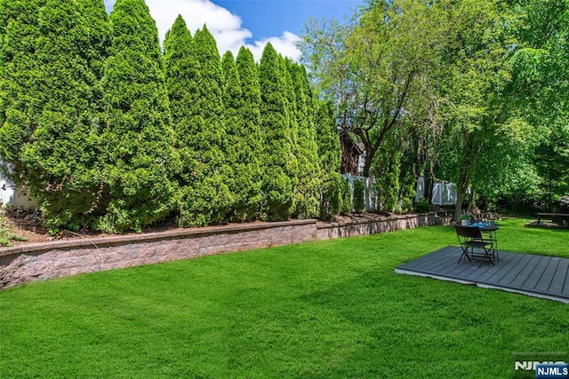 434 Argyle St, Oradell, NJ 07649 - view of green lawn with a wooden deck