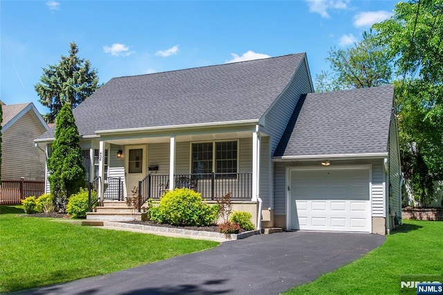 434 Argyle St, Oradell, NJ 07649 - view of front of house with an attached garage, asphalt driveway, a porch, a front lawn, and roof with shingles