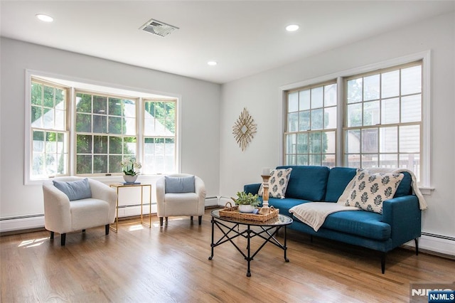 434 Argyle St, Oradell, NJ 07649 - living room with a baseboard heating unit, wood finished floors, and recessed lighting