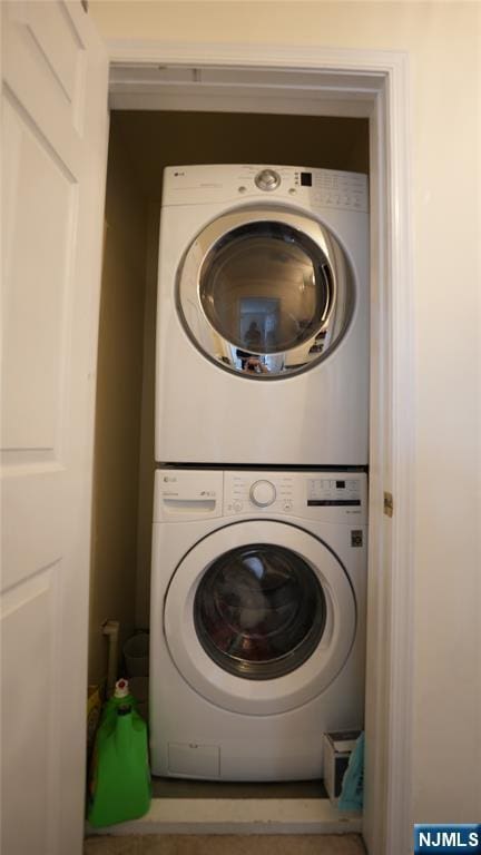 336 Village Ct Unit 3201, Fort Lee, NJ 07024 - washroom featuring stacked washer / dryer