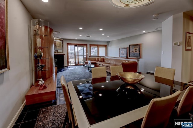 dining area featuring baseboards and recessed lighting