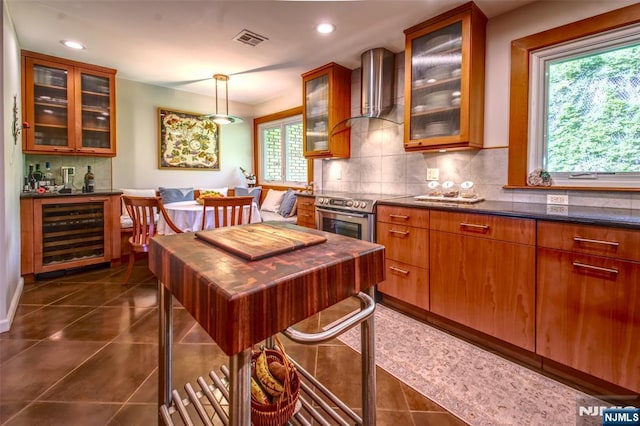 kitchen with wine cooler, stainless steel range with electric stovetop, wall chimney range hood, tasteful backsplash, and recessed lighting