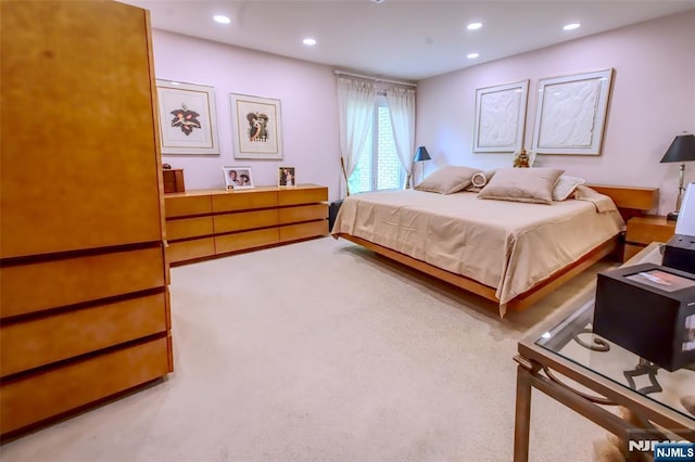 carpeted bedroom with recessed lighting