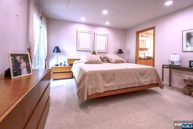 bedroom featuring carpet flooring, recessed lighting, and ensuite bathroom