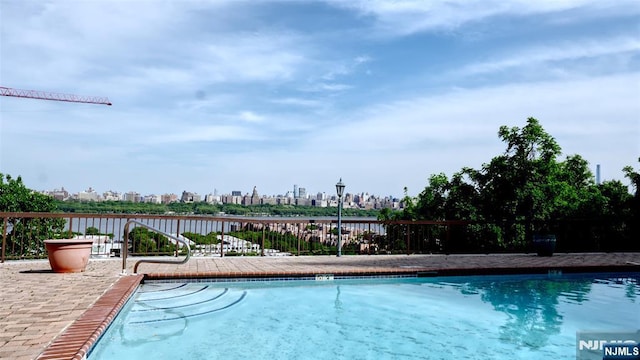 community pool with a skyline view