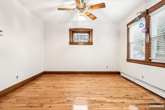 12-67 12th St, Fair Lawn, NJ 07410 - spare room with a baseboard radiator, healthy amount of natural light, and light wood-style flooring