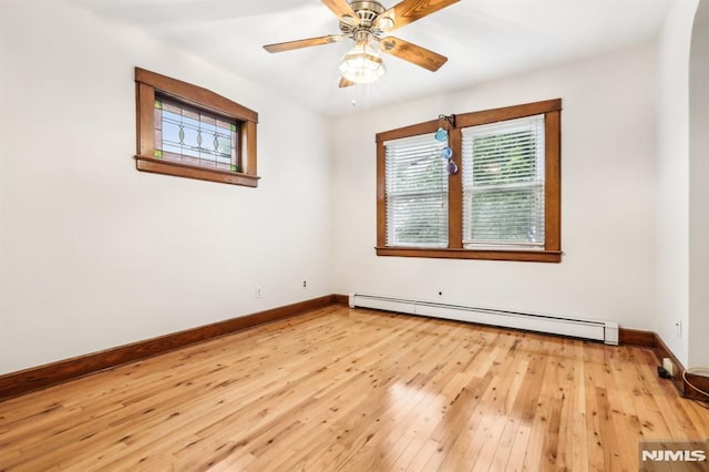 12-67 12th St, Fair Lawn, NJ 07410 - unfurnished room featuring a baseboard heating unit, baseboards, light wood-type flooring, and a ceiling fan