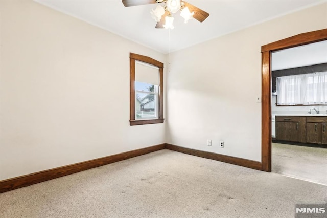 12-67 12th St, Fair Lawn, NJ 07410 - unfurnished room with light carpet, a ceiling fan, a sink, and healthy amount of natural light