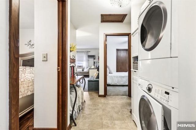 12-67 12th St, Fair Lawn, NJ 07410 - washroom featuring estacked washer and dryer and light tile patterned floors