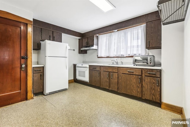 12-67 12th St, Fair Lawn, NJ 07410 - kitchen with white appliances, under cabinet range hood, light countertops, baseboards, and light floors