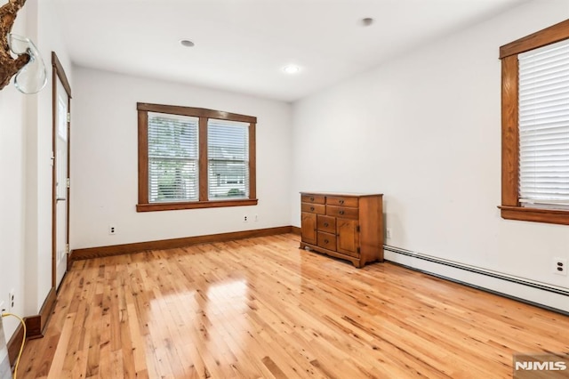 12-67 12th St, Fair Lawn, NJ 07410 - unfurnished bedroom featuring light wood-style flooring, a baseboard radiator, recessed lighting, and baseboards