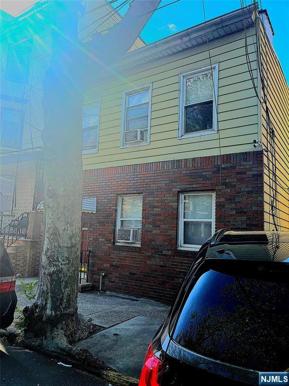 view of home's exterior featuring brick siding