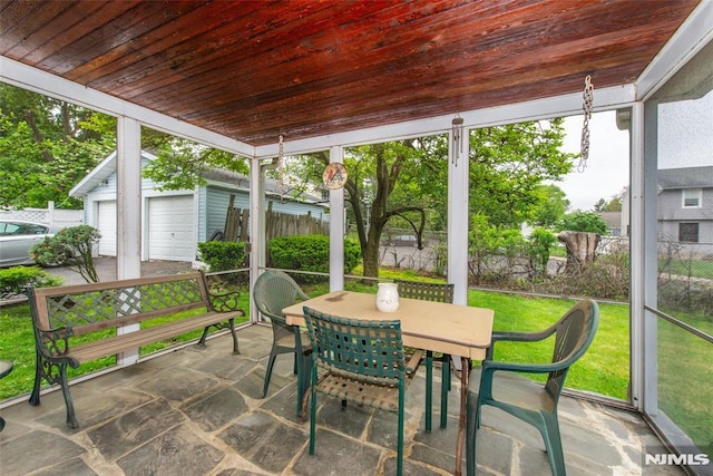sunroom / solarium with outdoor dining space