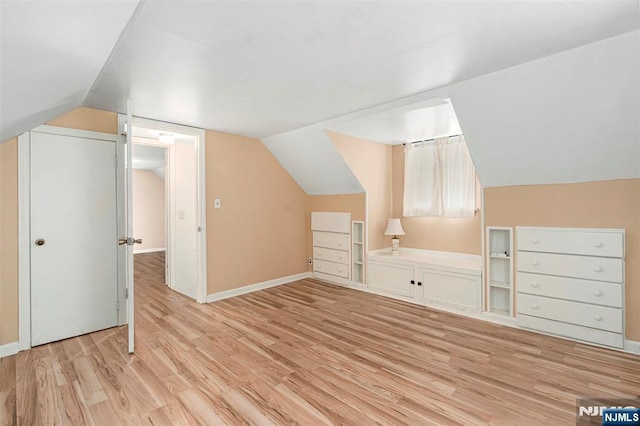 59 Harrison Ave, Saddle Brook, NJ 07663 - additional living space featuring light wood-style floors, vaulted ceiling, and baseboards