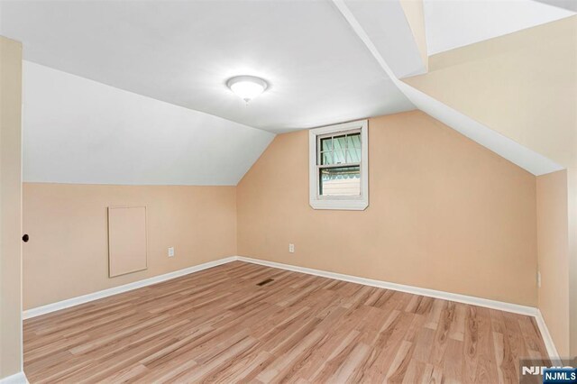 59 Harrison Ave, Saddle Brook, NJ 07663 - bonus room with light wood-style floors, baseboards, and vaulted ceiling