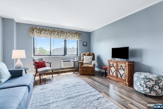 living area with ornamental molding, wood finished floors, and baseboards