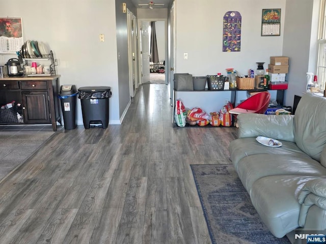 living area featuring wood finished floors and baseboards