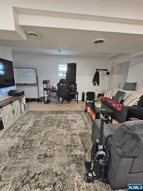 living room with tile patterned flooring