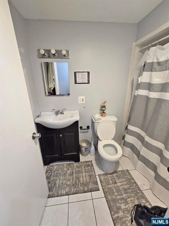 full bath with vanity, tile patterned floors, toilet, and a shower with curtain