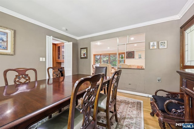 20 Old Farm Rd, Caldwell, NJ 07006 - dining space featuring light wood finished floors, ornamental molding, and baseboards