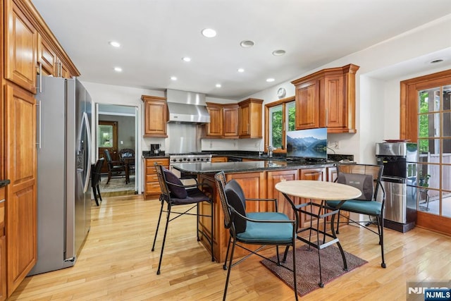 20 Old Farm Rd, Caldwell, NJ 07006 - kitchen with stainless steel fridge, wall chimney range hood, light wood-type flooring, plenty of natural light, and recessed lighting