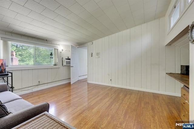 20 Old Farm Rd, Caldwell, NJ 07006 - living area featuring hardwood / wood-style flooring, baseboards, and wood walls