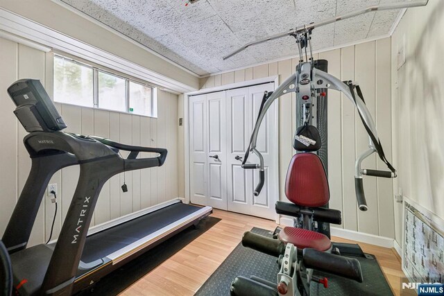 20 Old Farm Rd, Caldwell, NJ 07006 - exercise area featuring wood finished floors and a decorative wall