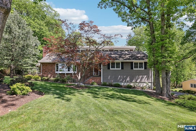 20 Old Farm Rd, Caldwell, NJ 07006 - view of front facade featuring a front yard and a chimney