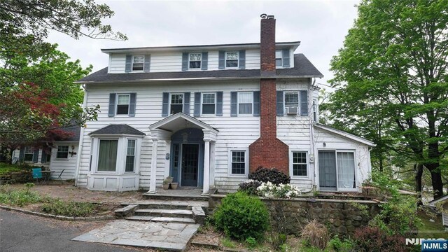 view of front of home with a chimney