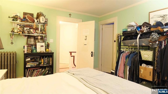 bedroom featuring radiator heating unit and ornamental molding