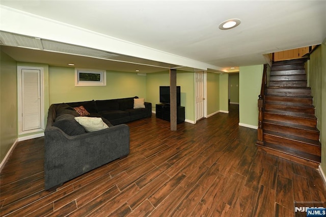 living room with wood finished floors, baseboards, stairs, and recessed lighting