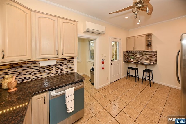 kitchen featuring an AC wall unit, appliances with stainless steel finishes, backsplash, light tile patterned floors, and ceiling fan