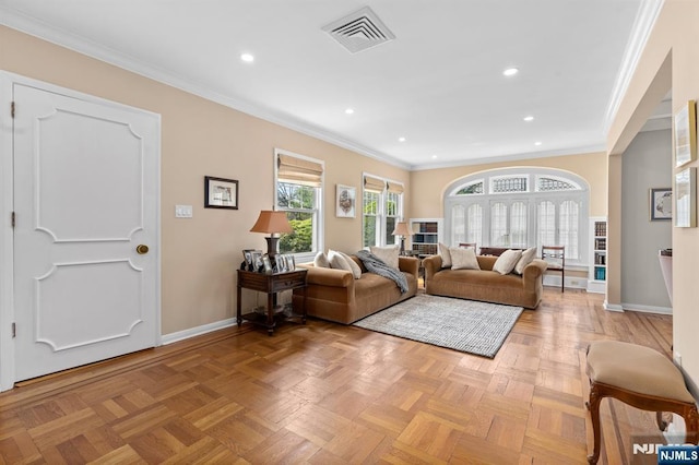 living room with baseboards, ornamental molding, and recessed lighting