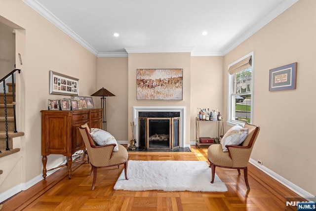 sitting room featuring crown molding, a fireplace, baseboards, and recessed lighting