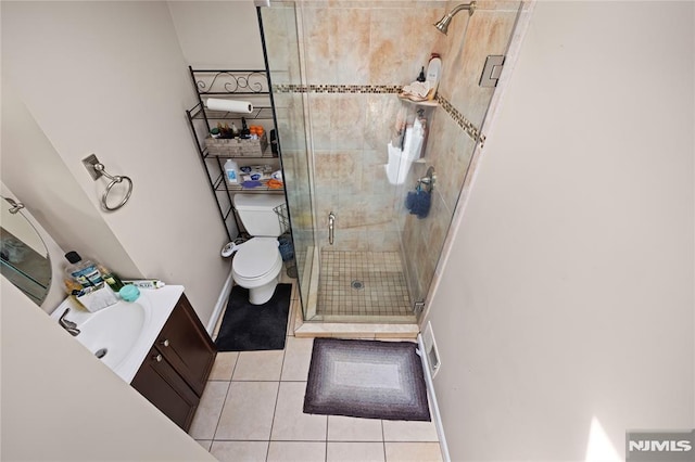 186 10th Ave, Hawthorne, NJ 07506 - bathroom featuring tile patterned flooring, a stall shower, toilet, vanity, and baseboards