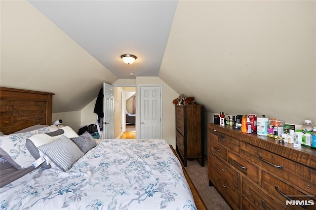 186 10th Ave, Hawthorne, NJ 07506 - bedroom with light carpet and vaulted ceiling