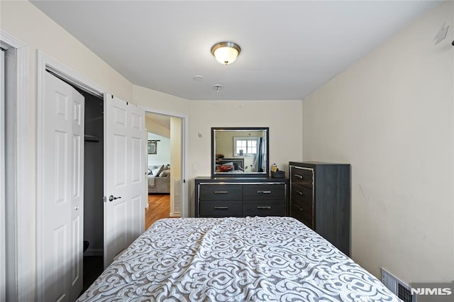 186 10th Ave, Hawthorne, NJ 07506 - bedroom featuring wood finished floors and a closet