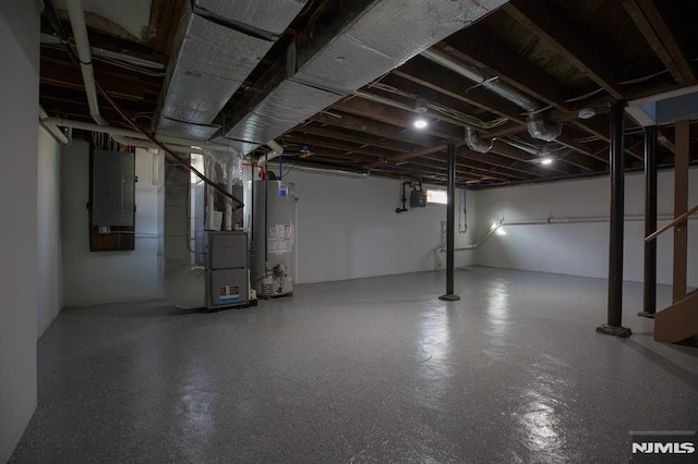 below grade area featuring gas water heater, heating unit, and electric panel