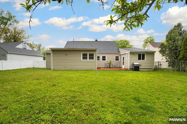 back of property featuring a wooden deck