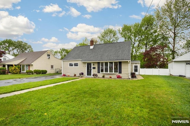 view of front of house featuring a chimney