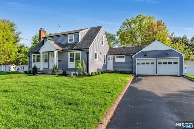 cape cod house with a chimney, driveway, a garage, and a shingled roof