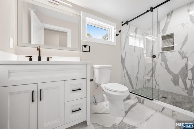 bathroom with marble look tile flooring, a marble finish shower, toilet, and vanity