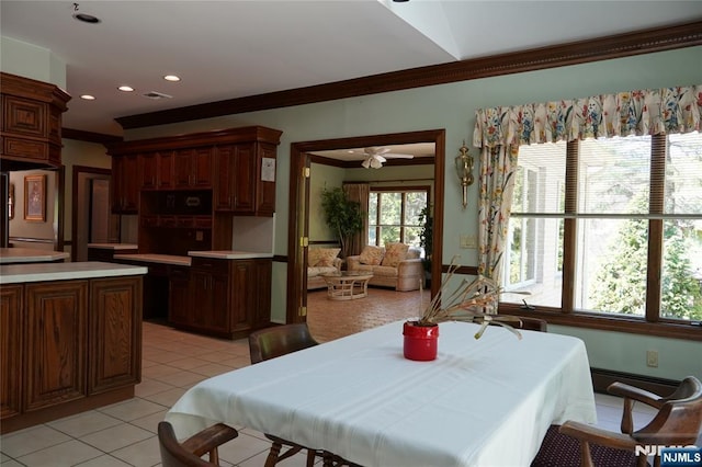 dining space with ornamental molding, light tile patterned floors, a ceiling fan, and recessed lighting