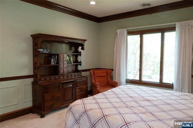 bedroom with ornamental molding, light colored carpet, and recessed lighting