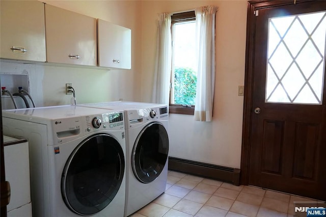 laundry room featuring baseboard heating, cabinet space, washing machine and dryer, and light tile patterned floors