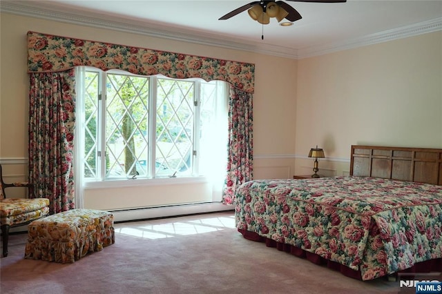 bedroom featuring a baseboard heating unit, carpet flooring, multiple windows, ornamental molding, and a ceiling fan