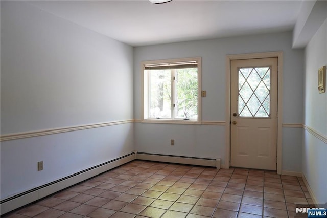 doorway to outside featuring baseboard heating