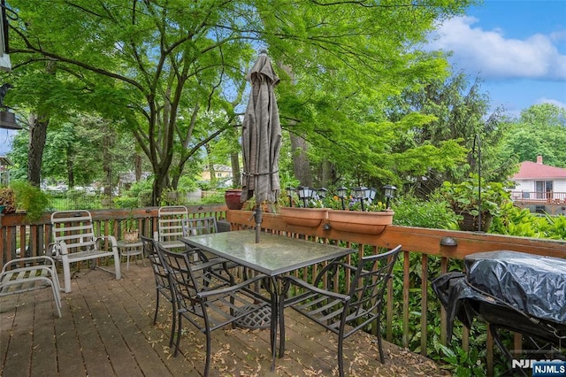 deck featuring outdoor dining area